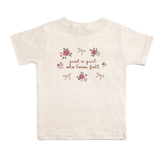 Short sleeve T-shirt featuring "Just A Fall Girl" design by Sweet Wink, casual apparel with autumn-inspired style.