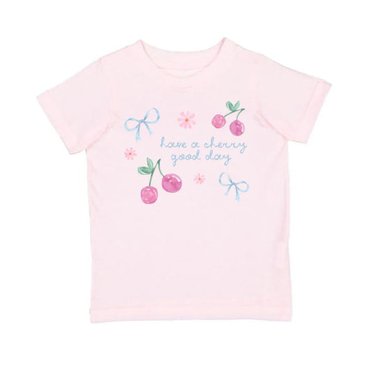 Sweet Wink Ballet Cherry Good Day short sleeve T-shirt featuring a cherry graphic on a casual white fabric.