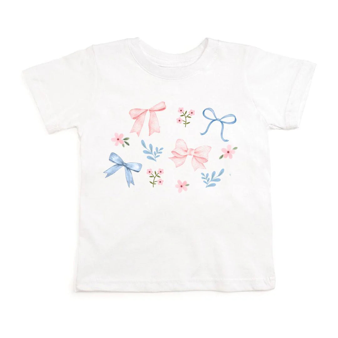White floral and bow watercolor short sleeve T-shirt by Sweet Wink, showcasing a delicate floral and bow design on soft fabric.