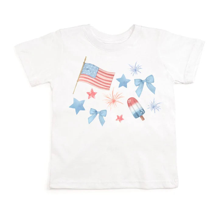 White patriotic watercolor short sleeve t-shirt by Sweet Wink featuring vibrant red, white, and blue design on soft fabric.