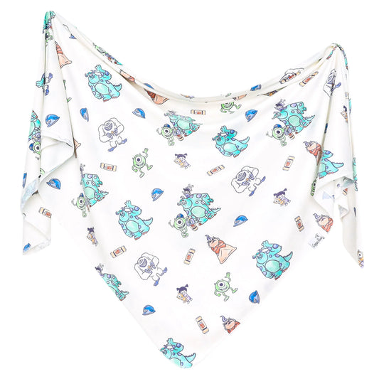 Copper Pearl Monsters Inc. Friends knit swaddle blanket featuring colorful Monsters Inc. characters on soft, cozy fabric.
