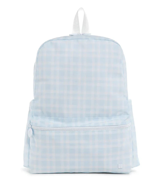 TRVL Designs backpack featuring a blue plaid fabric with leather accents, casual style, and adjustable shoulder straps.