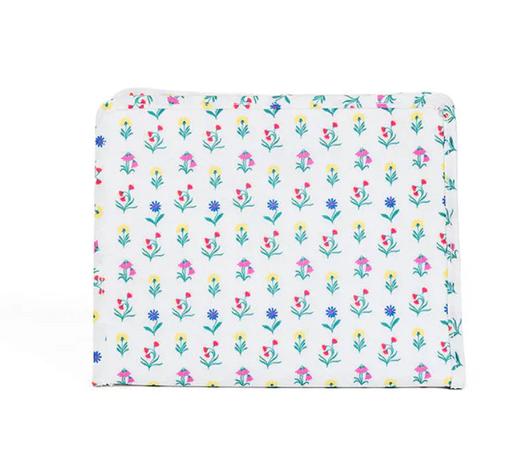 Large zip pouch from TRVL Designs with a vibrant wildflower pattern, perfect for organizing travel essentials.