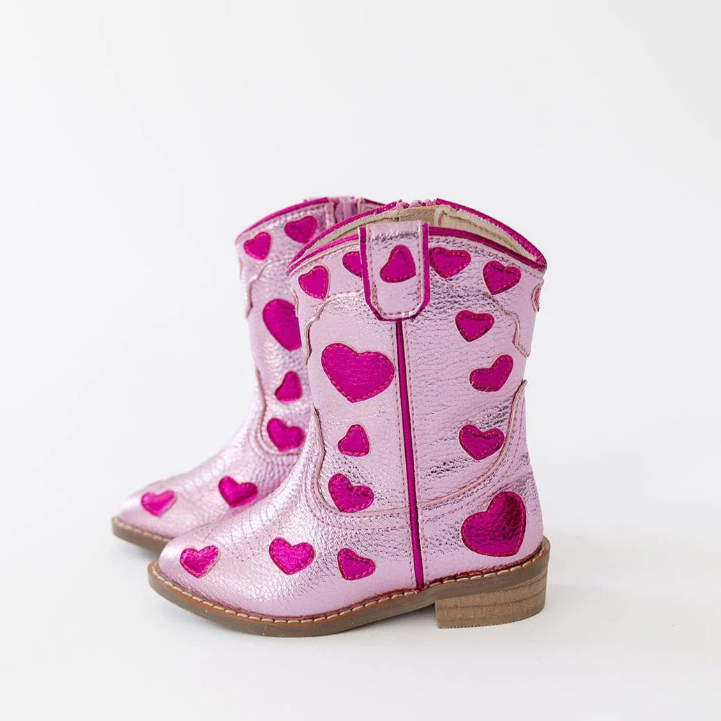 Wild + Rae Cowgirl Lovestruck Boots featuring pointed toes, decorative stitching, and classic Western style in tan leather.