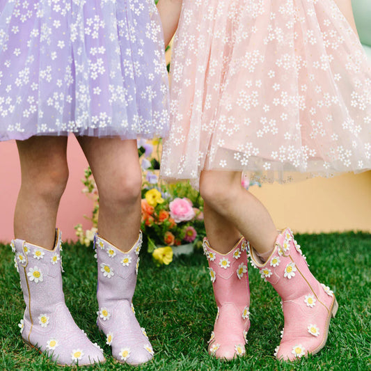 Pink cowgirl boots with daisy embroidery from Wild + Rae, featuring a stylish oopsie daisy design and durable leather construction.