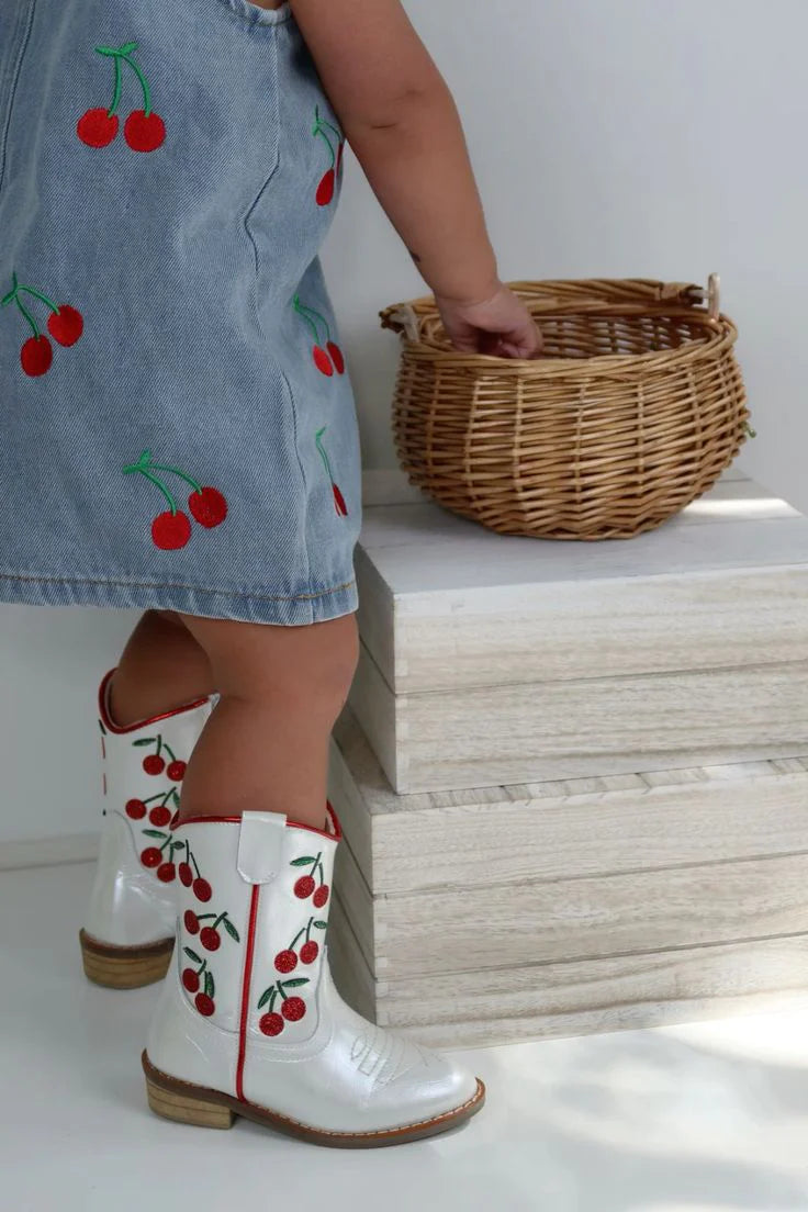 Cowgirl Wild Cherry Boots by Wild + Rae featuring red leather, pointed toes, and Western-inspired design.