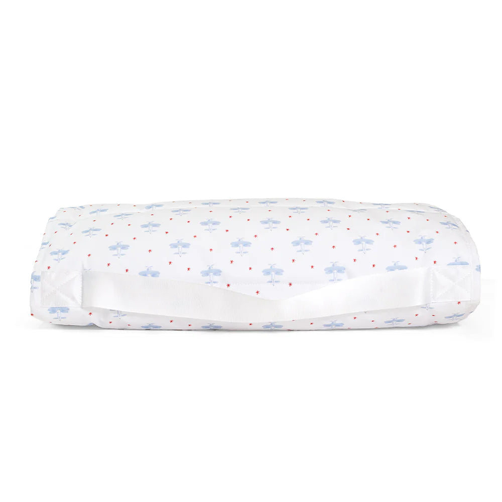 TRVL Design nap mat with airplane pattern, portable kids' sleeping mat for travel and naps, featuring colorful airplane illustrations.