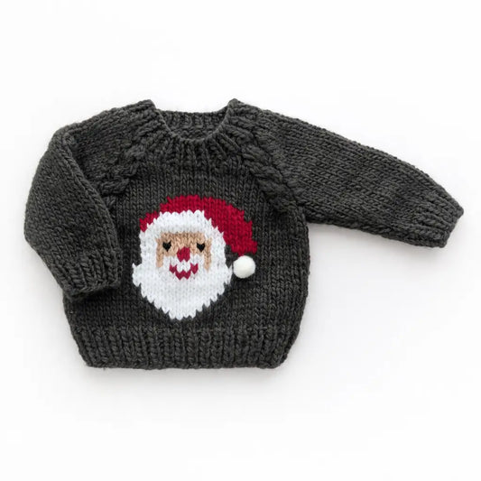 Baby wearing Huggalugs Jolly Santa Sweater in Loden, featuring festive holiday design for infants and toddlers.