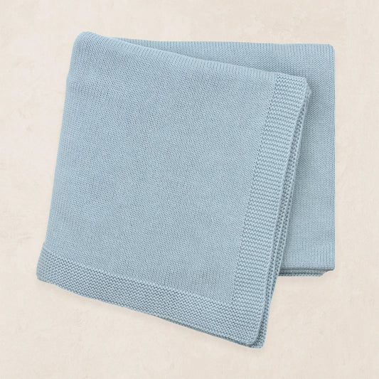 Blue Steele Knit Blanket from Lou Lou & Co, showcasing soft, cozy knit fabric with a smooth, textured finish.