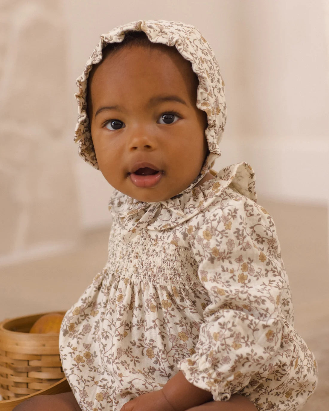 Quincy Mae Posy Callie romper for babies, featuring soft fabric and floral print, displayed on a white background.