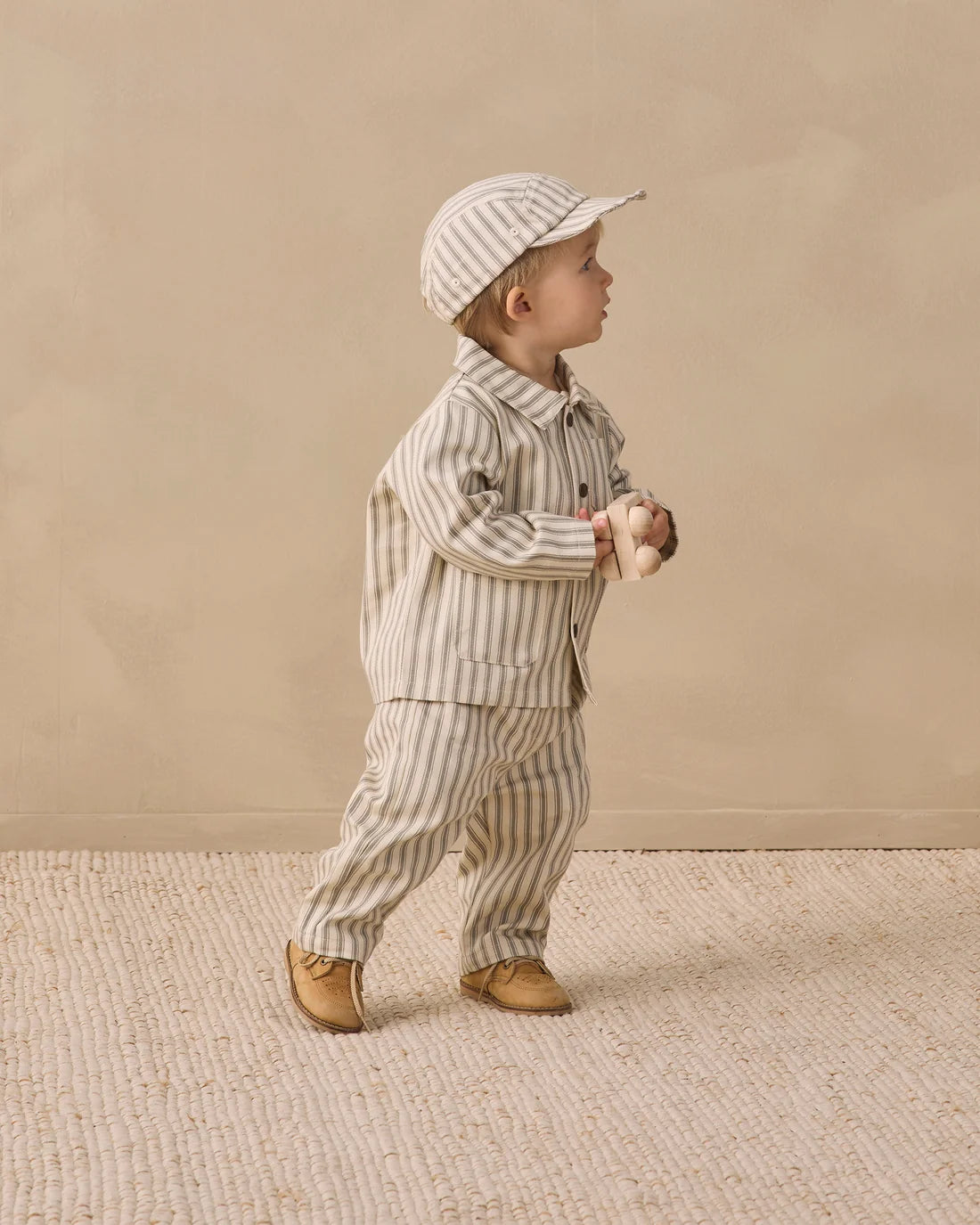Quincy Mae Laurel Pinstripe Grayson Pant featuring navy and white pinstripe fabric, relaxed fit, and elastic waistband for kids.