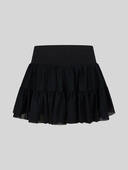 Black girls mesh double-tier ruffle skort with inner shorts by 90 Degree by Reflex, showcasing layered ruffle design and comfortable fit.
