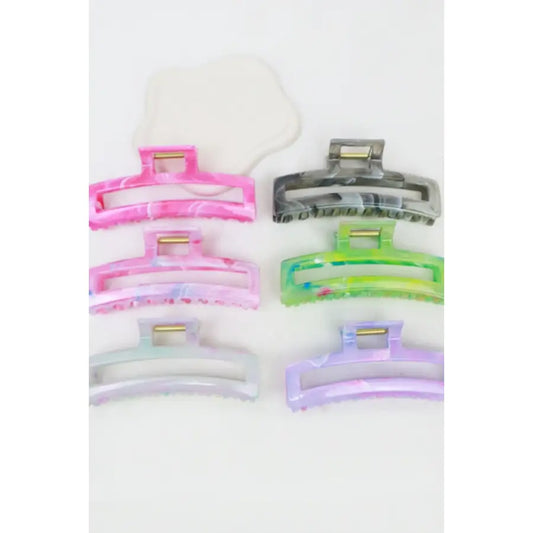Love and Repeat shimmering marbled rectangle hair claw clip with cut-out design, perfect for stylish hair accessories.