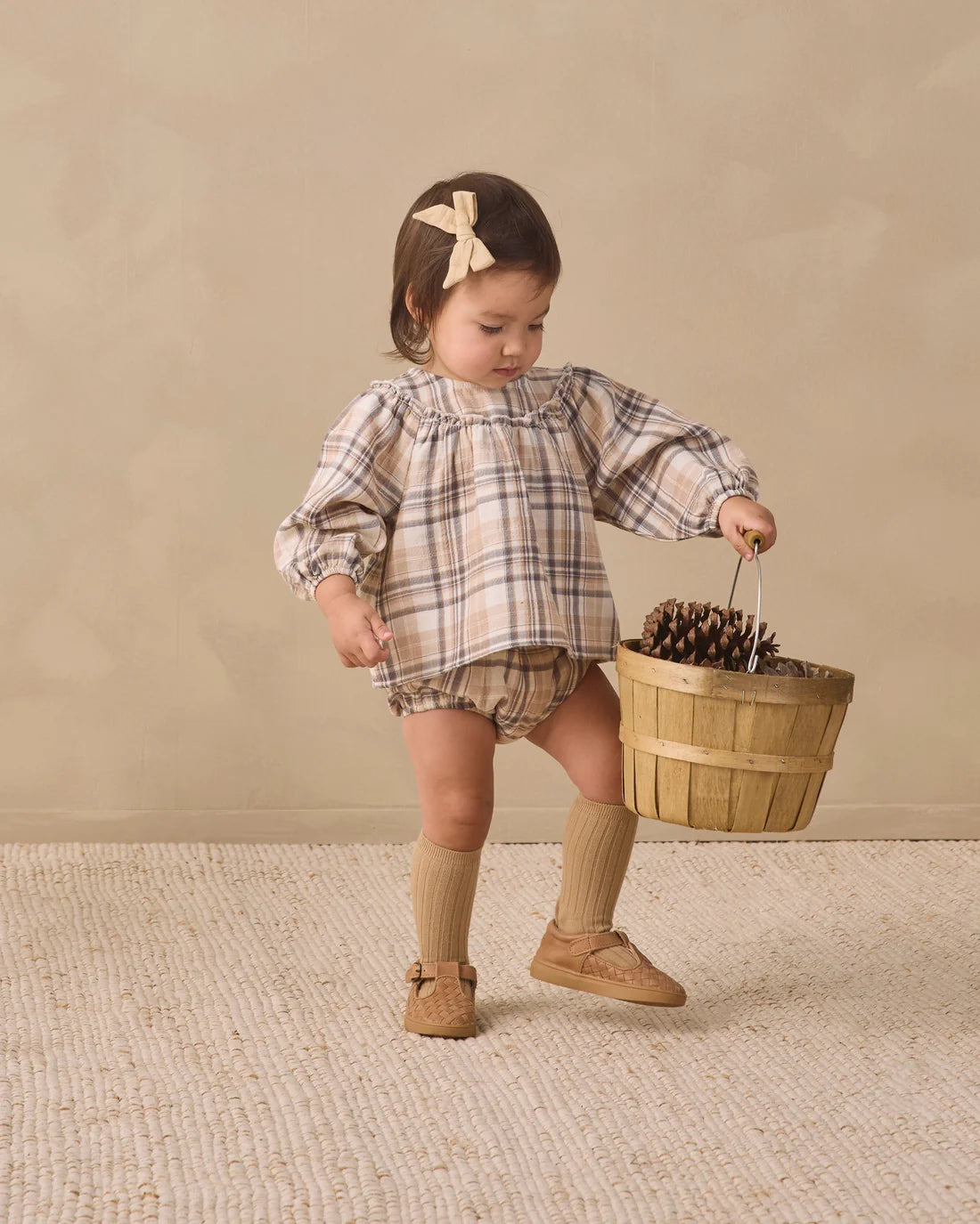 Fall plaid Mia top and bloomer set by Quincy Mae featuring a cozy plaid pattern for babies.