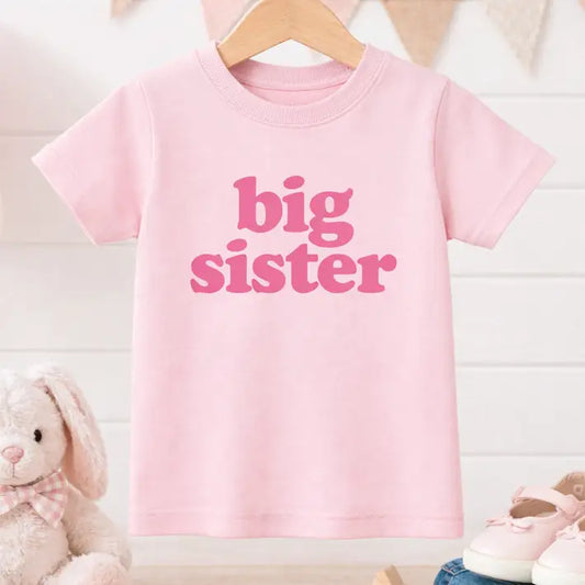 Big Sister Kids T-Shirt by Bump & Beyond Designs featuring playful text and comfortable fabric for young girls.