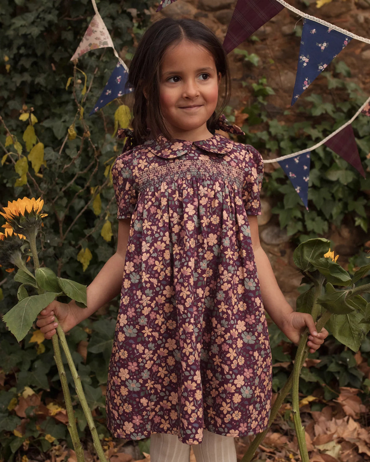 Early Sunday Garden Flowers Plum Erika Dress made of printed cotton satin, front view showing floral design and fitted waist.