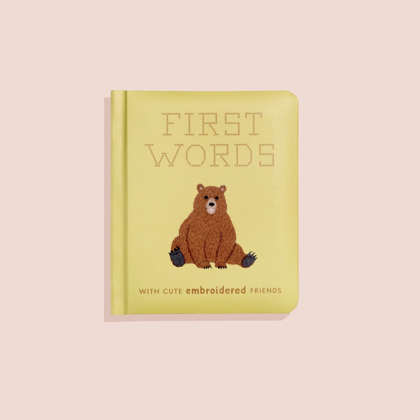 Colorful children's book titled First Words with cute embroidered animal friends by Sweet E's Children's Boutique, featuring playful illustrations.