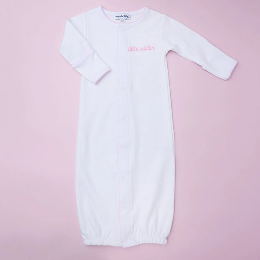 Magnolia Baby Little Sister embroidered converter showing soft fabric with pink embroidery and snap closures.