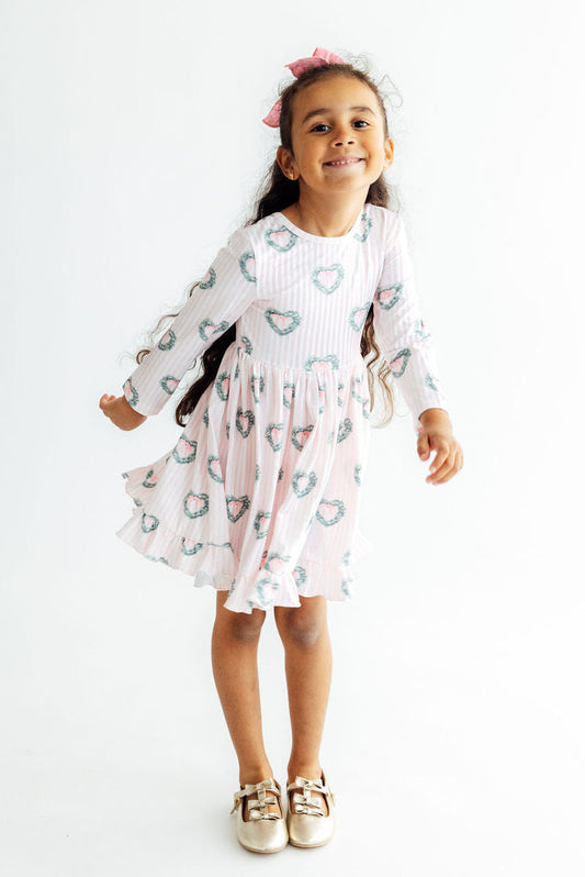 Pink Christmas charm long-sleeve twirl dress with ruffle hem for girls by Mila & Rose, featuring festive holiday details.