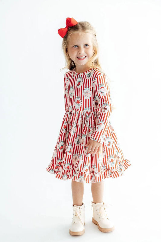 Mila & Rose Santa's Sweet Shoppe long sleeve ruffle hem twirl dress for girls, pink with festive holiday print and playful ruffle details.