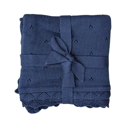 Navy knit blanket from Babysprouts featuring soft, cozy fabric and a smooth, textured knit pattern for baby comfort.