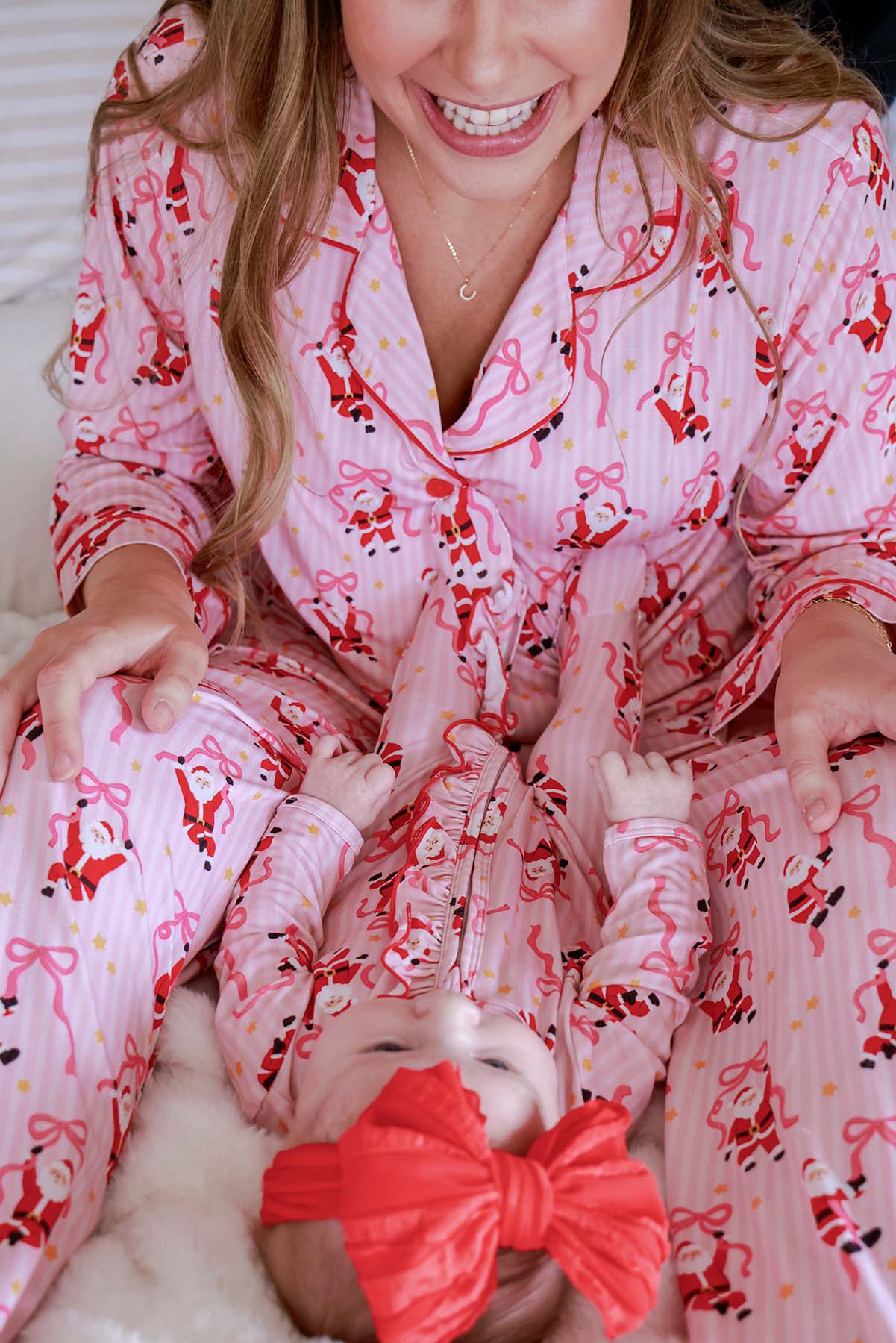 Caden Lane Jolly Ribbons Christmas Ruffle Zipper Footie for infants, featuring festive ribbon patterns and cozy fabric.