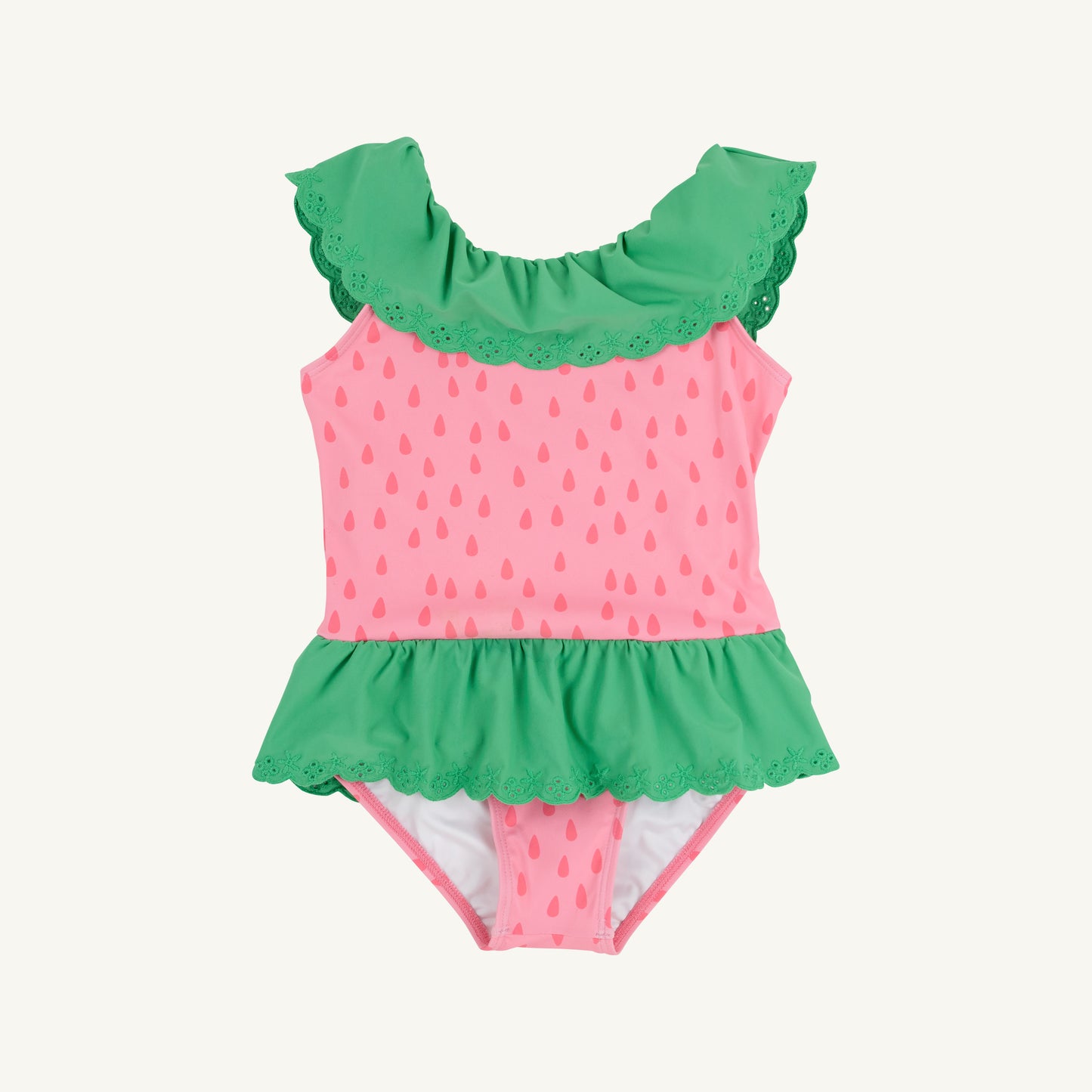 Sandy green Gibson Island swimsuit for children by The Beaufort Bonnet Company, featuring a playful design with ruffle details.