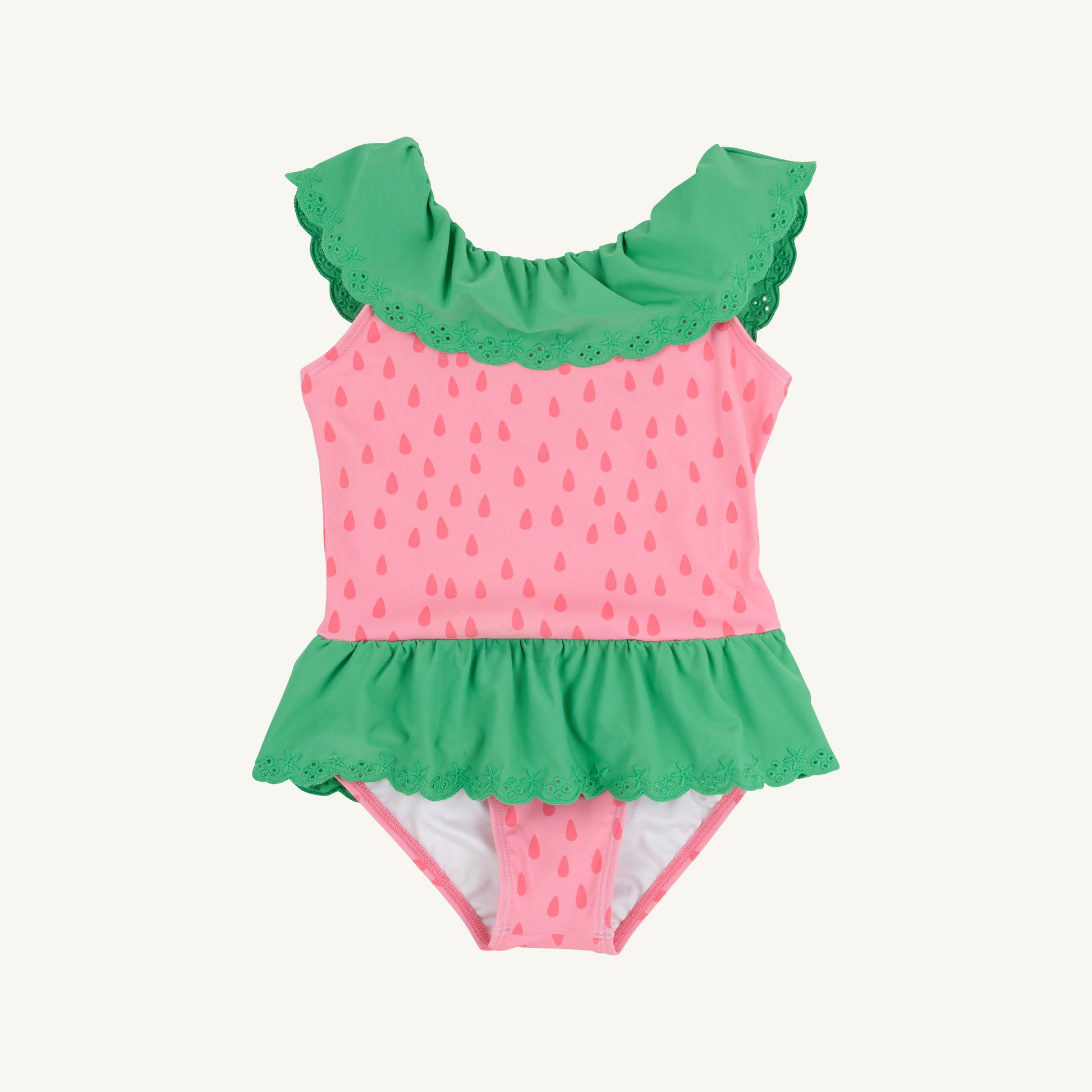 Sandy green Gibson Island swimsuit for children by The Beaufort Bonnet Company, featuring a playful design with ruffle details.