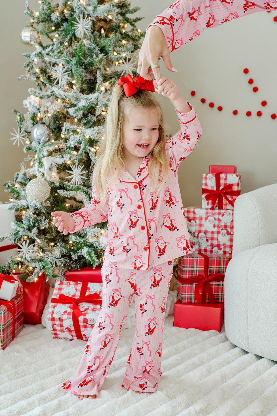 Caden Lane Jolly Ribbons Christmas two-piece flare lounge set with festive red, green, and white ribbon patterns on soft fabric