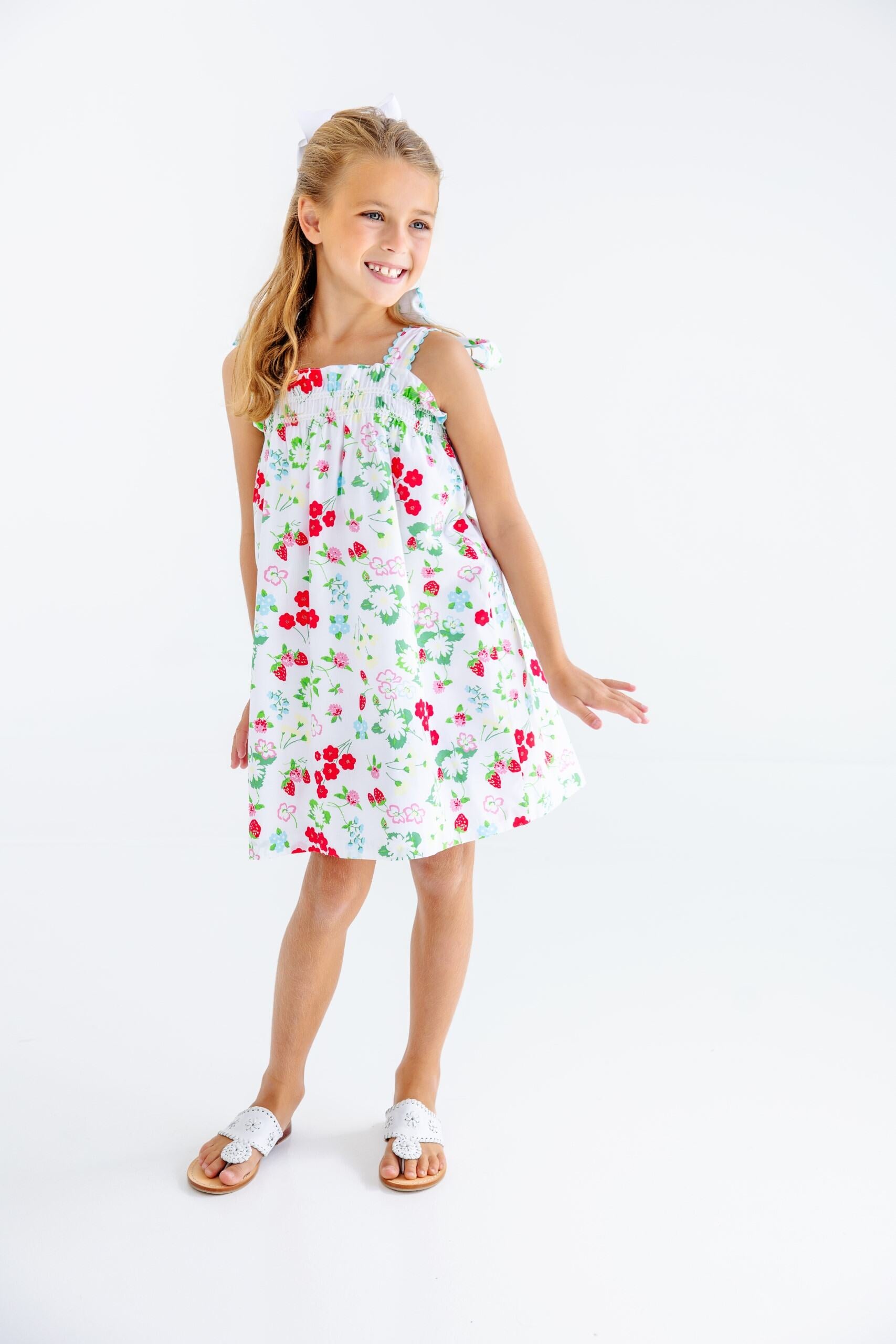 Blue Laineys Little Dress by The Beaufort Bonnet Company featuring a Berry Sweet and Belhaven Blue pattern with ruffled sleeves.