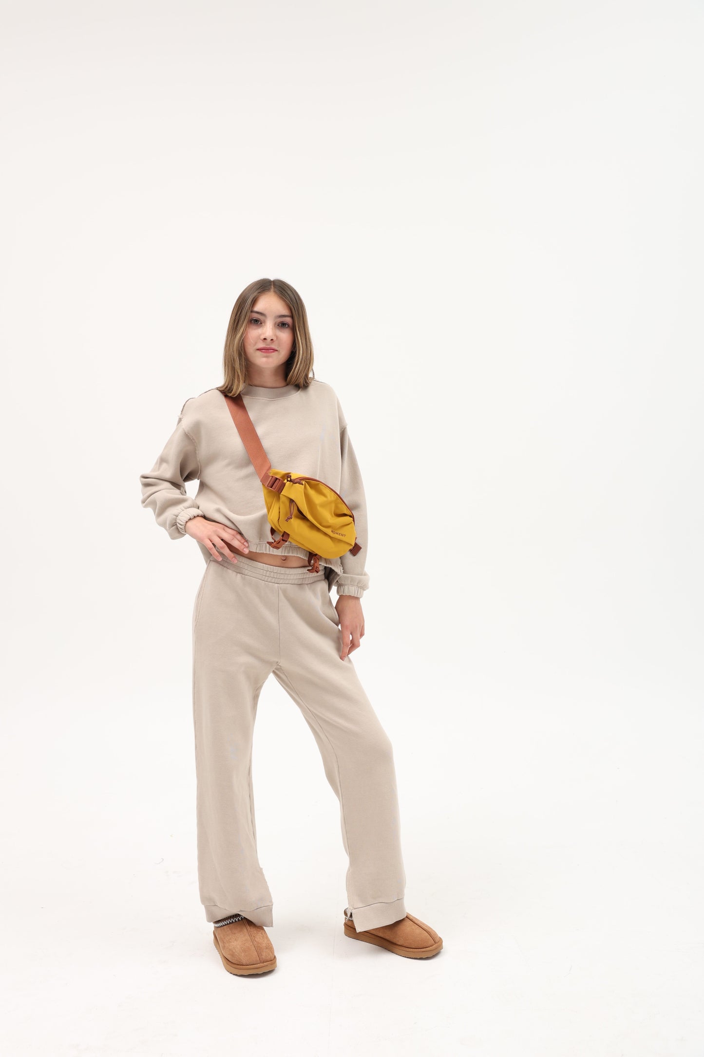 TENLY Soy Latte split hem pants featuring a relaxed fit and casual style, shown in a neutral-toned fabric.