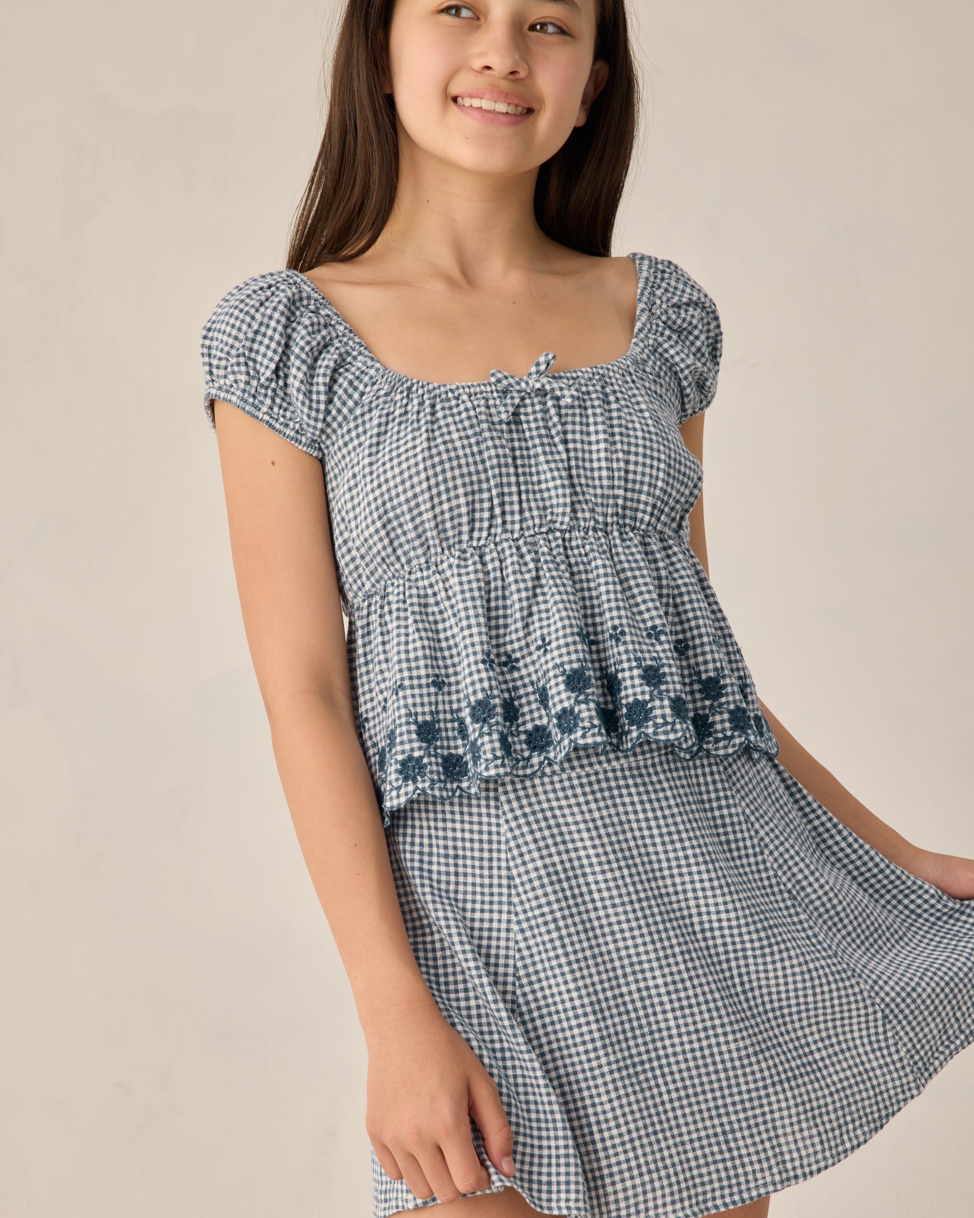 Teen Marine Gingham Rylan Top by Rylee & Cru featuring a blue and white gingham fabric and a casual, stylish design.