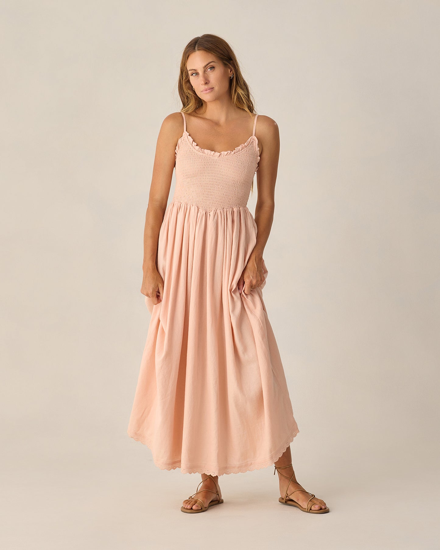 Women's blush Chrissy dress by Rylee & Cru, featuring a flowy fabric and stylish design, shown on a model.