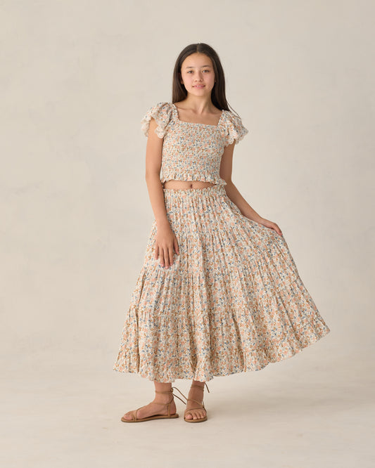 Rylee & Cru teen flower fields ruffle tiered maxi skirt with vibrant floral patterns and layered design in natural light.
