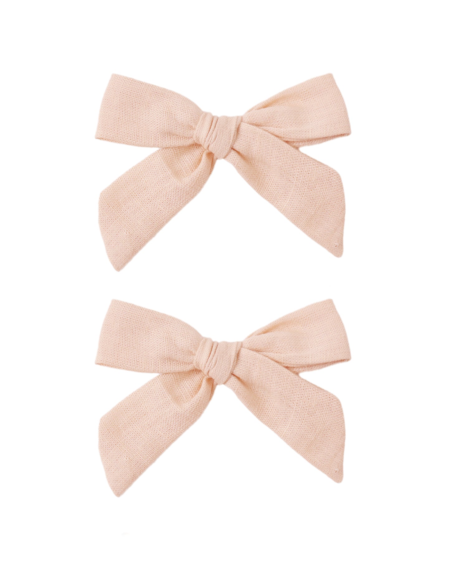 Set of two blush-colored fabric bows by Rylee & Cru, perfect for baby or toddler hair accessories.