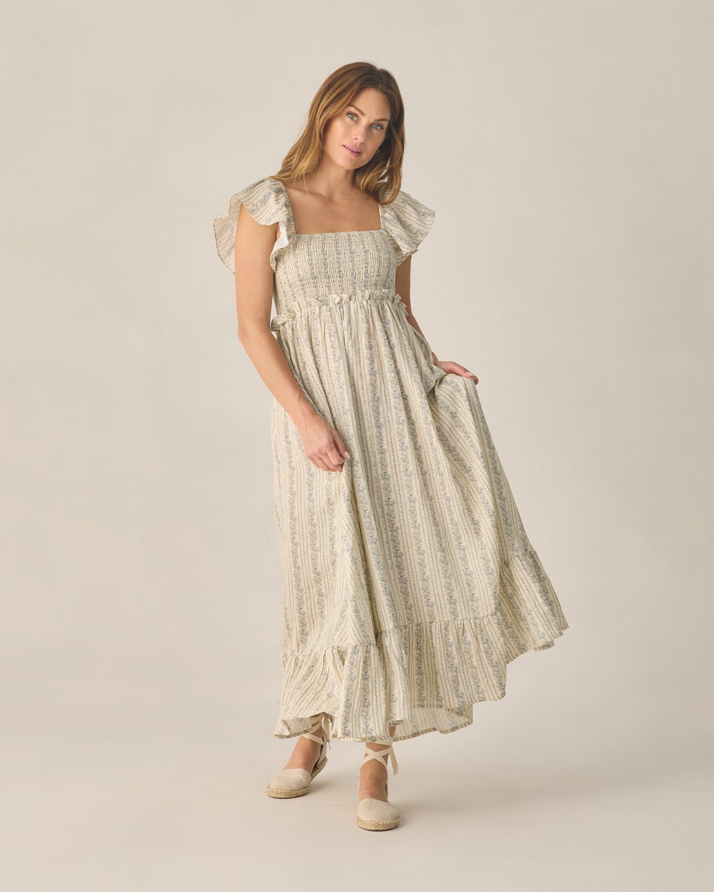 Women's blue floral Francesca dress by Rylee & Cru, featuring a flowy fabric and vibrant floral pattern.