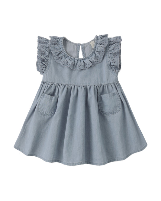 Quincy Mae Chambray Sophie Dress displayed on a hanger, featuring a soft blue chambray fabric and a classic, simple design.
