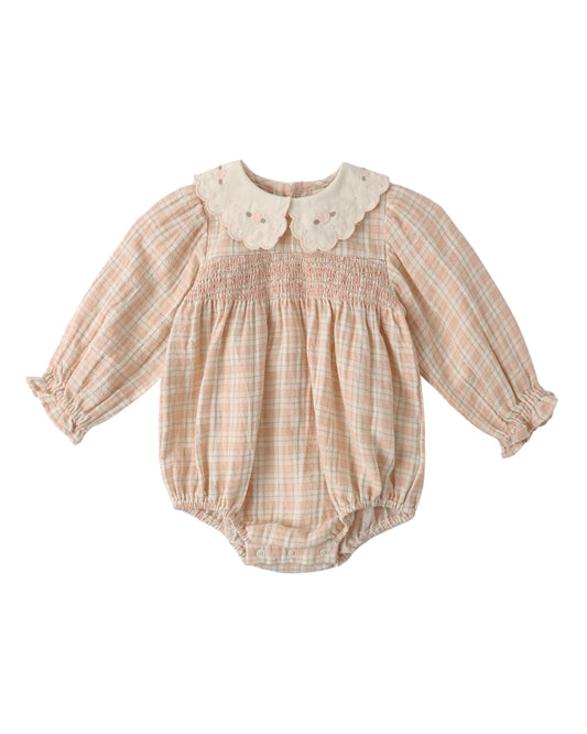 Pink plaid Callie romper by Quincy Mae, featuring soft fabric and a comfortable fit for babies or toddlers.