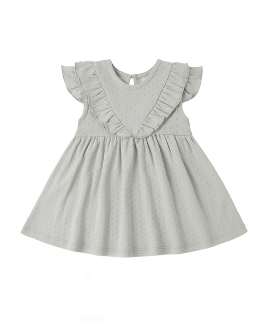 Sage sleeveless ruffle V dress by Quincy Mae featuring a soft fabric and delicate ruffle details on a child model.