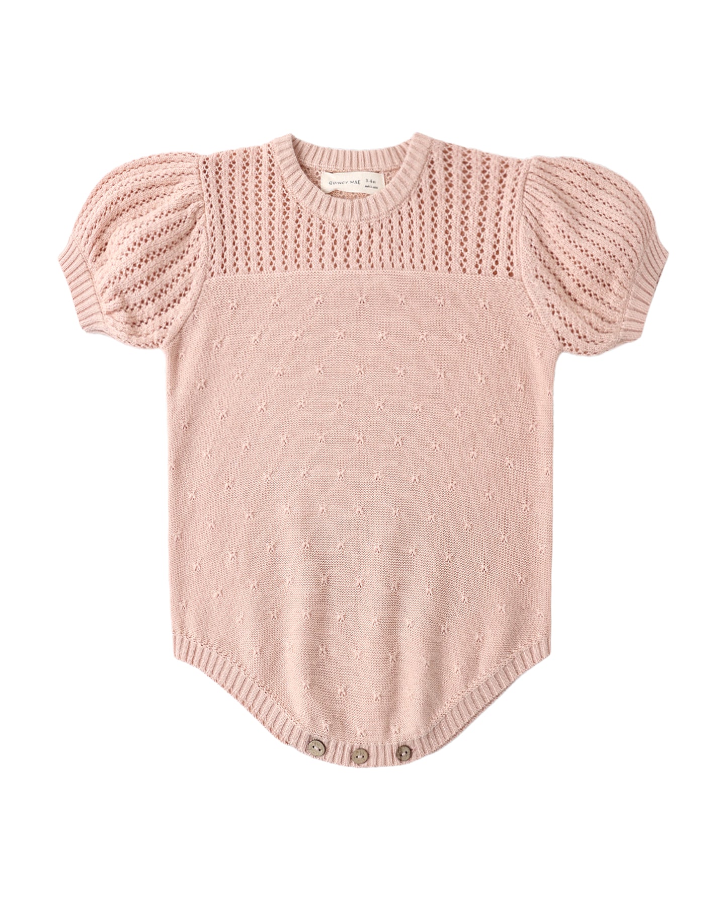 Quincy Mae melon-colored pointelle knit romper for babies, featuring soft fabric and delicate pattern, suitable for comfortable wear.
