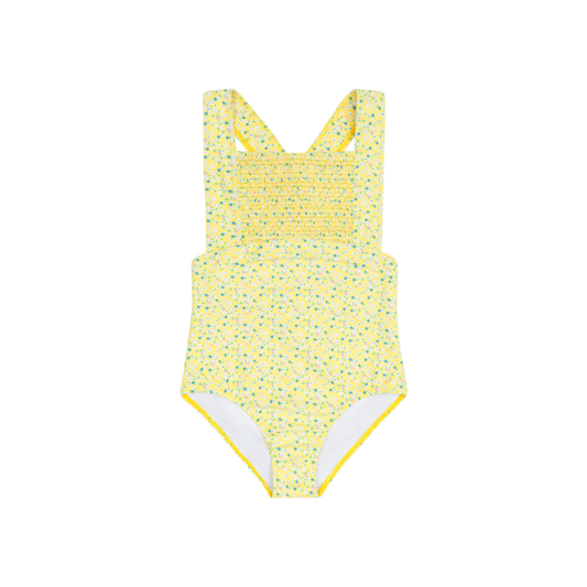 Girls petite Fleur diamond smocked one-piece by Minnow with floral pattern and delicate smocking details.