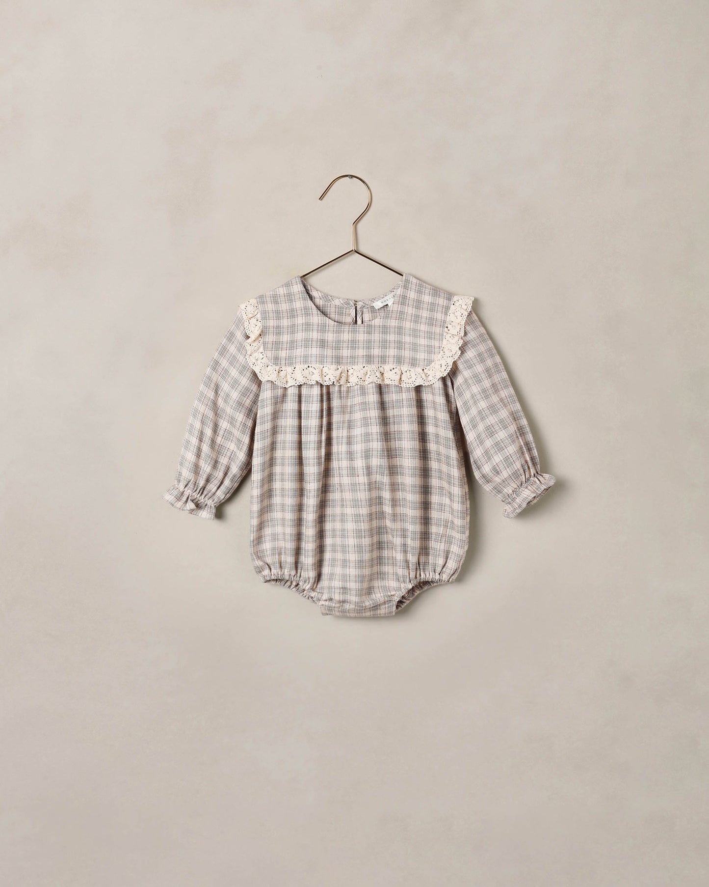 Noralee Fall Plaid Noelle Romper featuring a stylish plaid pattern, designed for a comfortable and trendy look.
