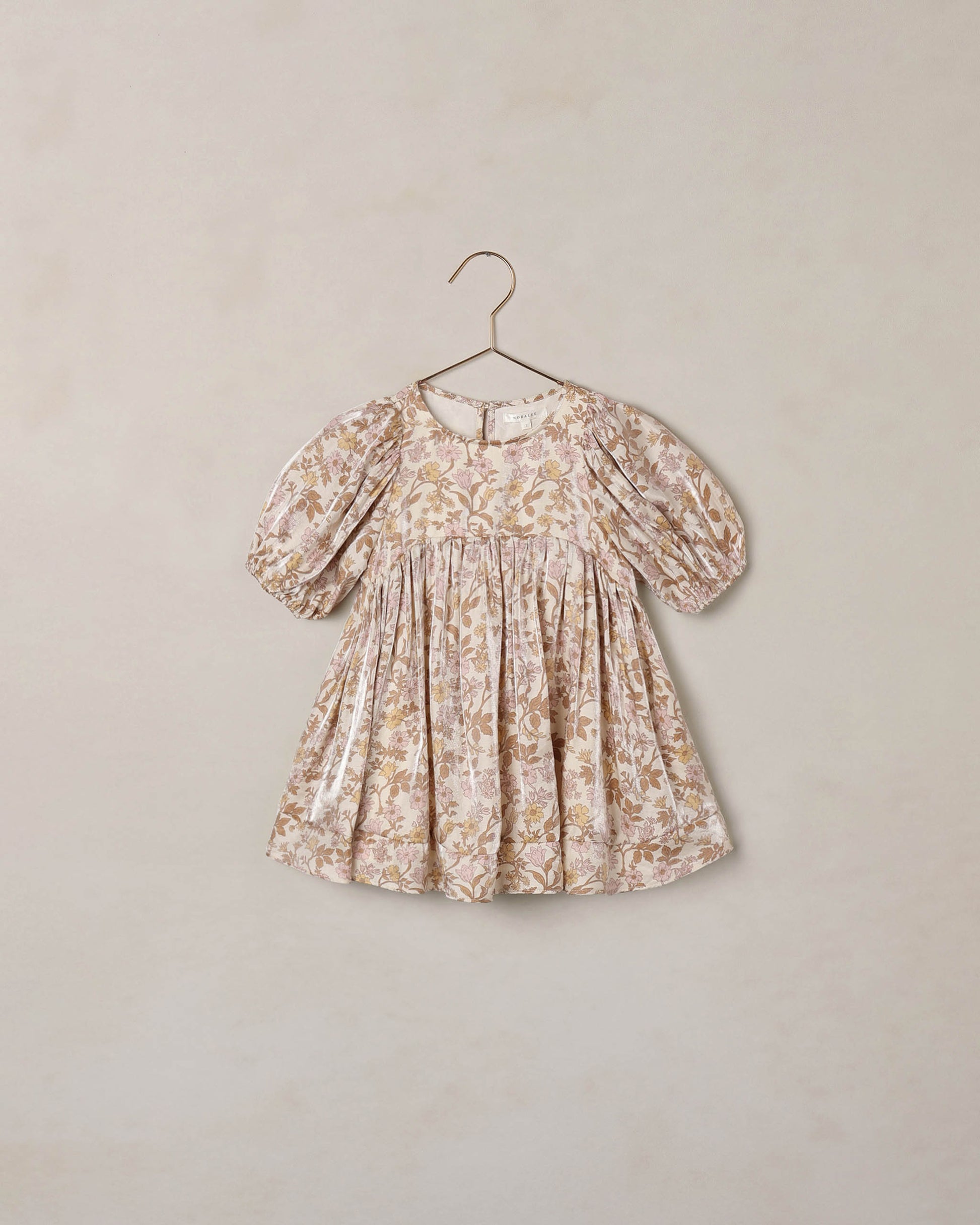 Wildflower Luna Dress by Noralee featuring a floral pattern and flowing fabric, displayed on a mannequin.