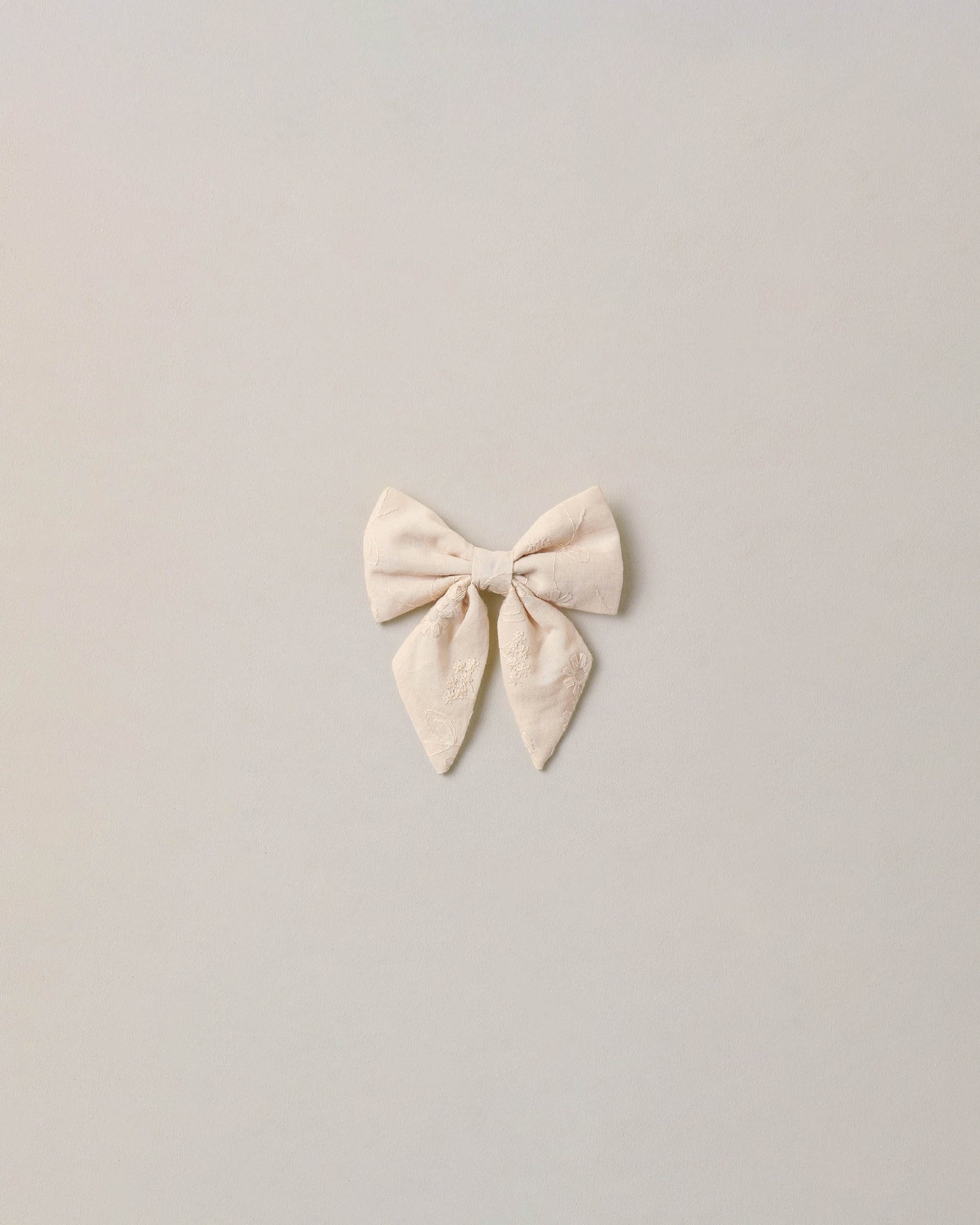 Noralee embroidered floral Norah bow with detailed embroidery and vibrant floral design, perfect for accessories or hair adornment.