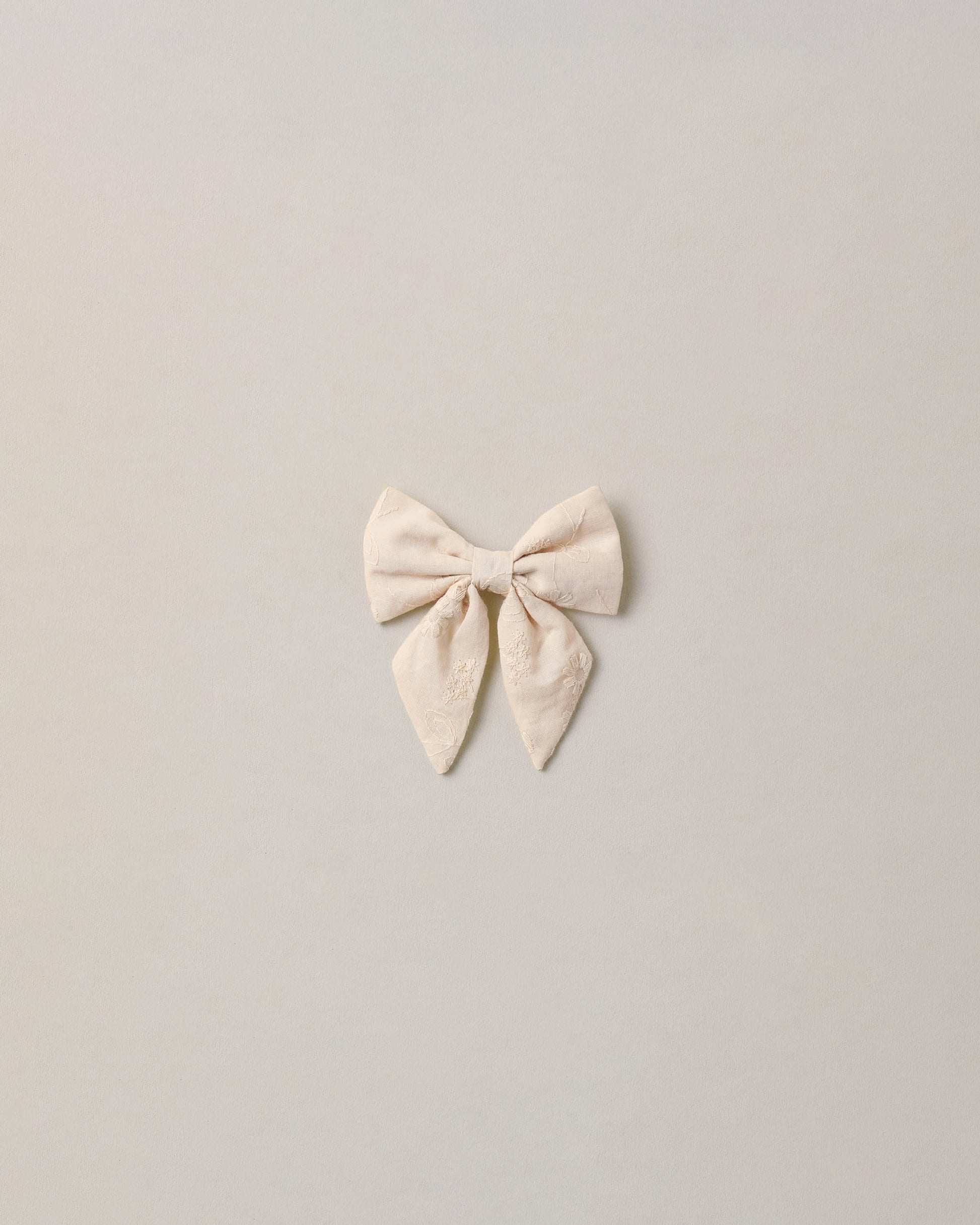 Noralee embroidered floral Norah bow with detailed embroidery and vibrant floral design, perfect for accessories or hair adornment.