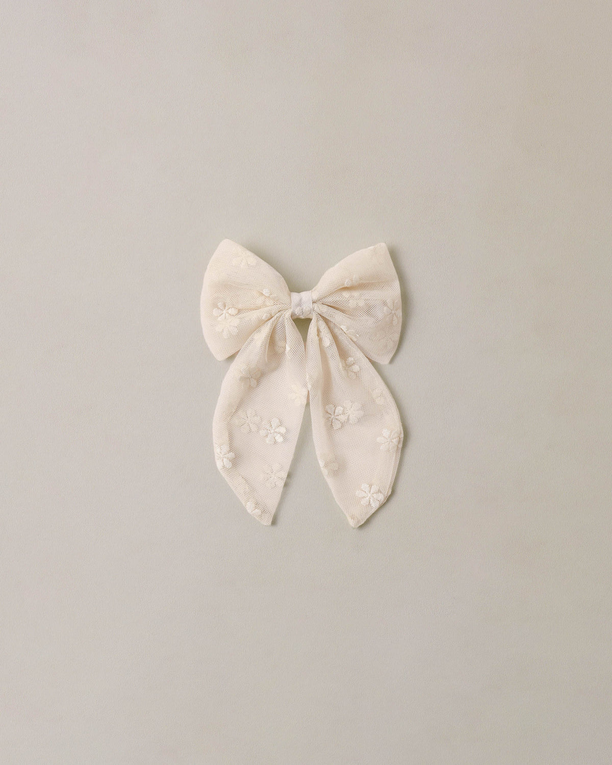 Noralee embroidered Daisy Everly Bow featuring delicate floral embroidery and a stylish hair accessory design.