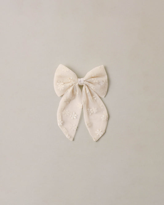 Noralee embroidered Daisy Everly Bow featuring delicate floral embroidery and a stylish hair accessory design.
