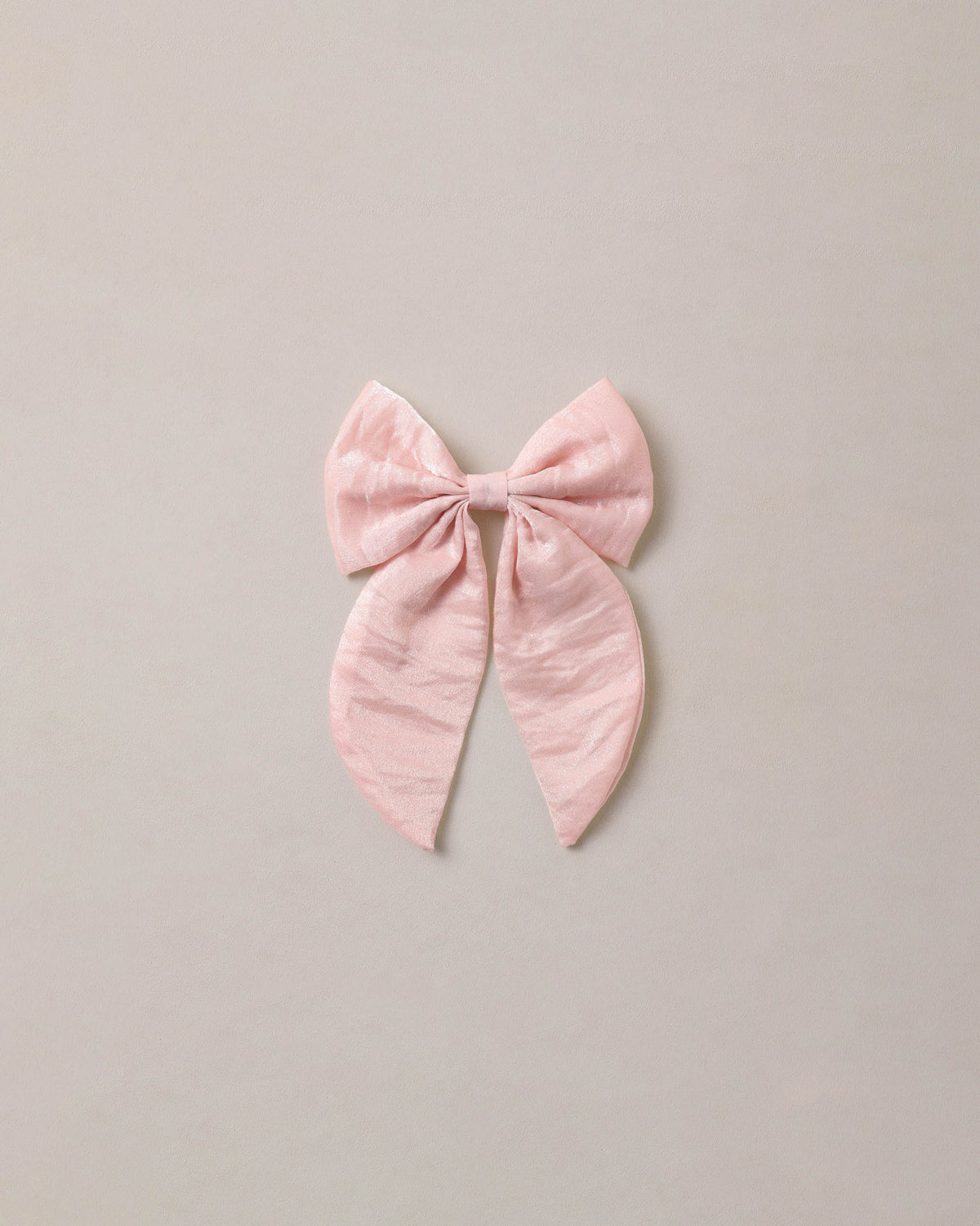 Noralee Rose Shimmer Everly Bow, a stylish hair accessory with a shimmering rose design and elegant bow detail.