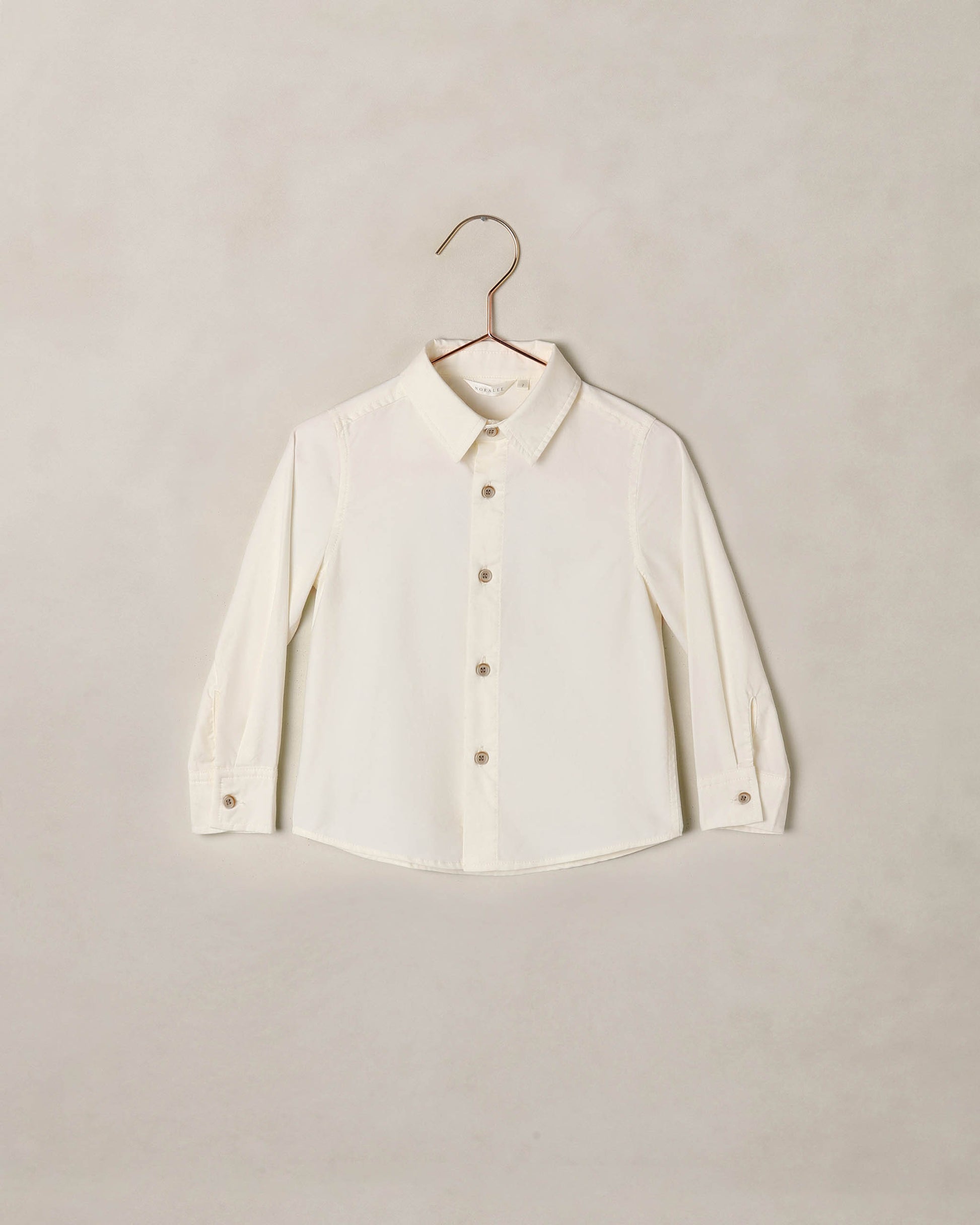 Ivory Noralee Harrison button-down shirt with collar and long sleeves, displayed flat on a white background.