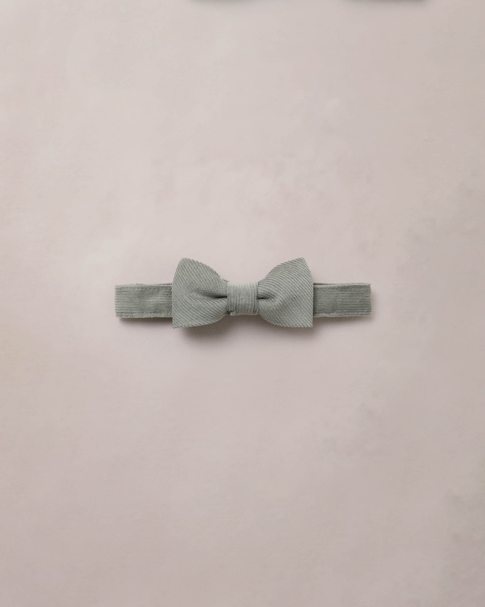 Eucalyptus-themed bow tie by Noralee featuring a green foliage pattern on fabric, stylish accessory for formal attire.